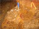 Show image 'Massive galena and bright red zinc zap reaction in Cinco Hermanos workings' in New Window